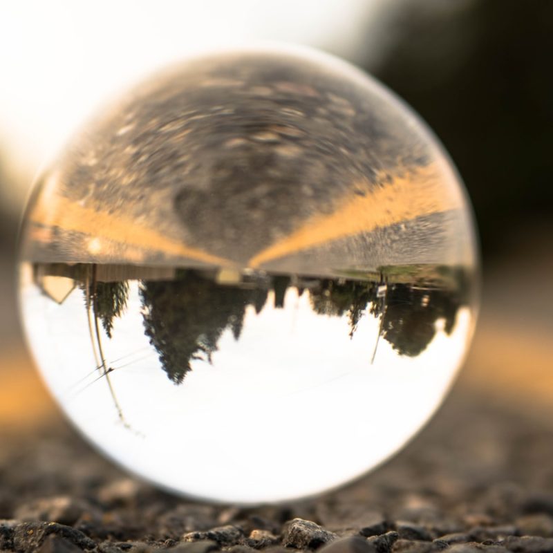clear glass ball on ground during daytime