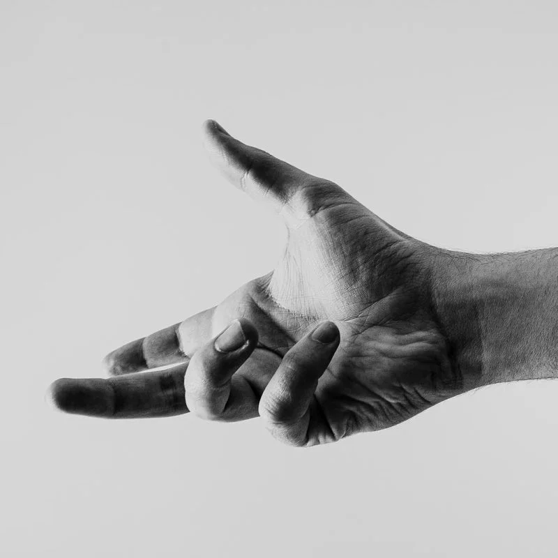 grayscale photo of persons hand