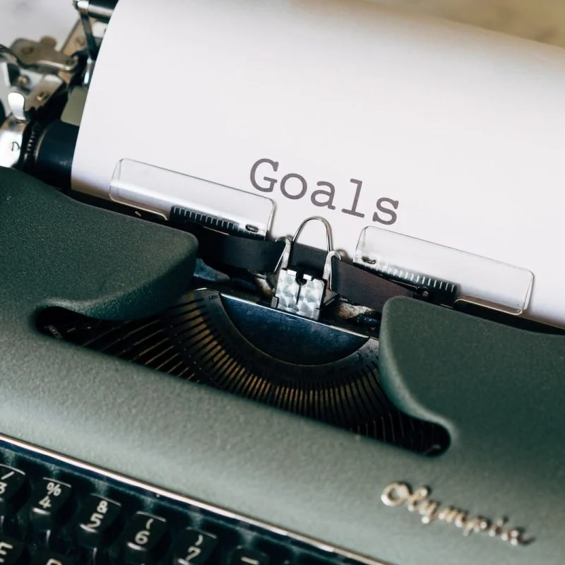 black and white typewriter on green textile