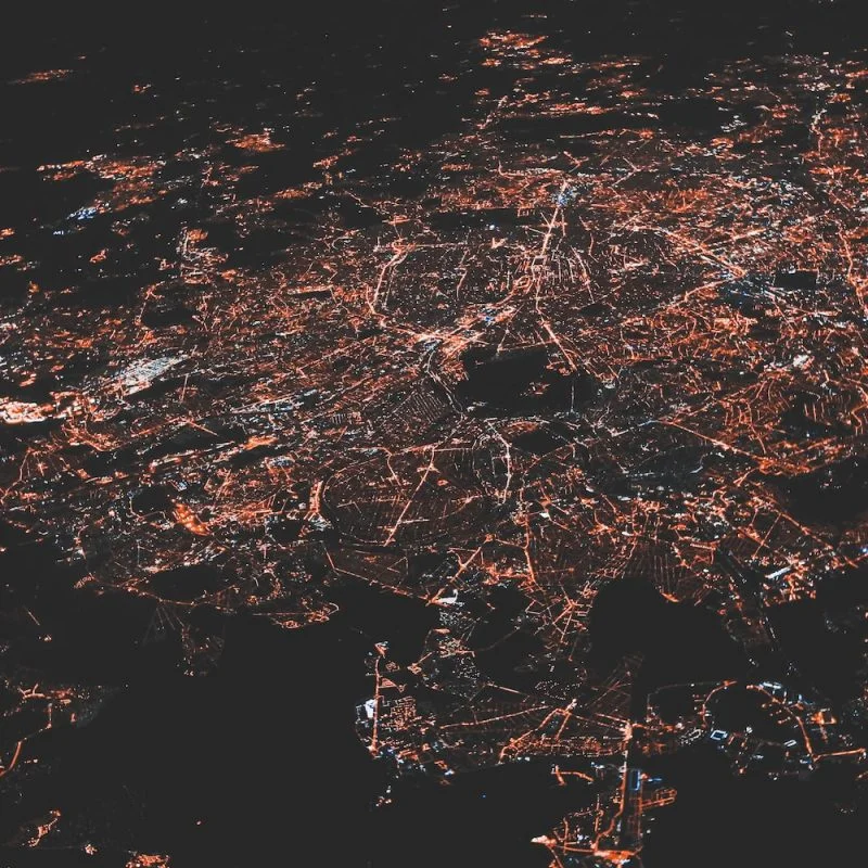 lighted city at night aerial photo