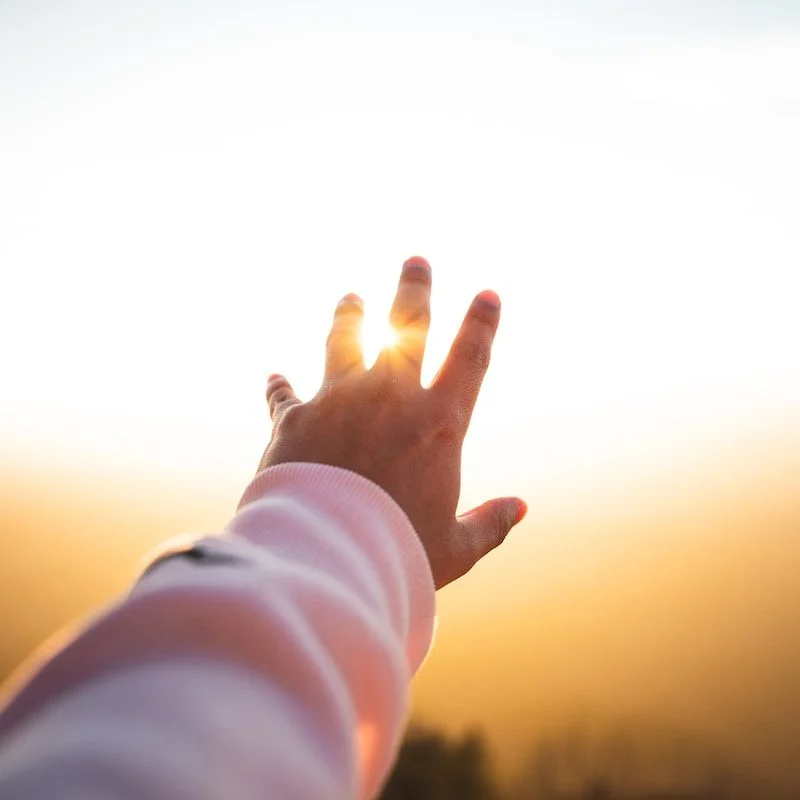 person lifting hand