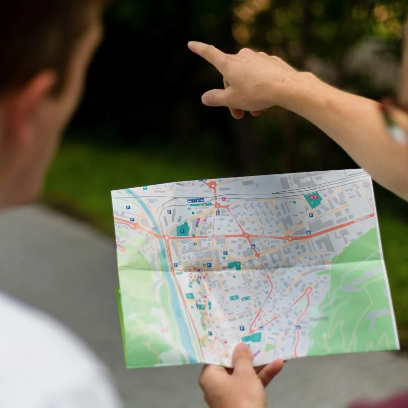 a person pointing at a map