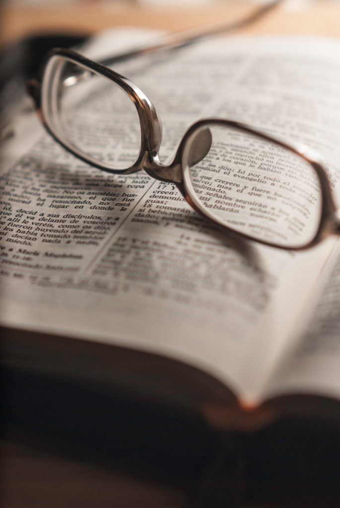 tilt-shift photography of eyeglasses with silver-colored frames