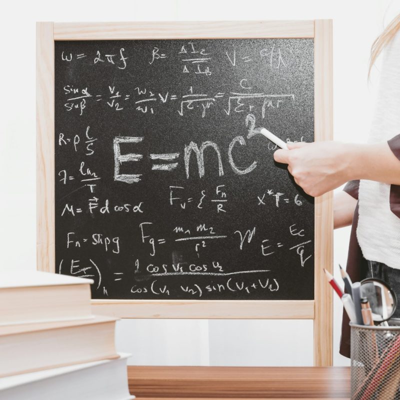 E-mc2 written on chalkboard