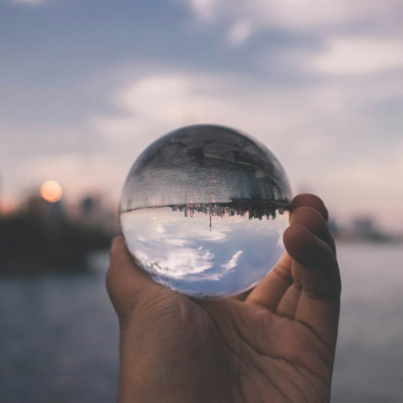 person holding crystal ball